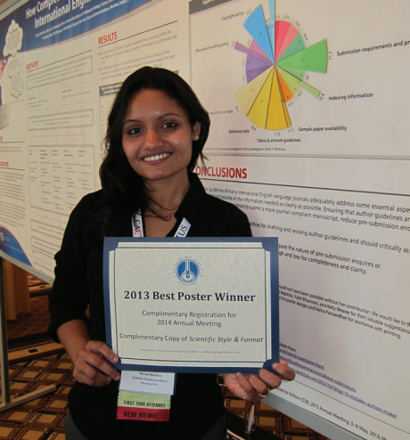 Poster winner Remya Namblar, with her poster on author guidelines of international journals.