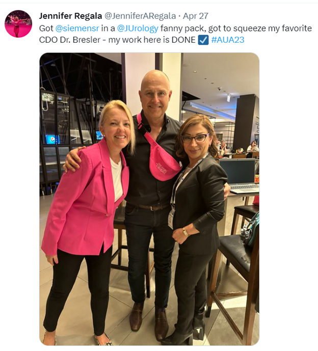 <b>Figure 2.</b> The JU Fanny Pack in all its perfect pink glory. From left to right, Jennifer Regala, American Urological Association (AUA) Director of Publications; D. Robert Siemens, Editor-in-Chief, <i>The Journal of Urology®</i>; Larisa Bresler, AUA Chief Diversity Officer.
